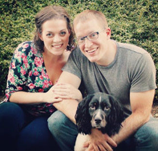 Photo of Kyle '07 and Katie Nowadnick with their dog Birdie. Link to their story.